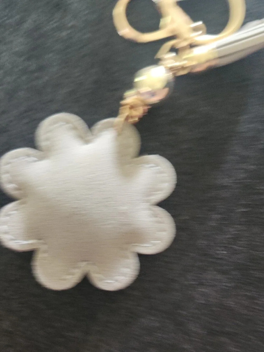Gold & Crystal Daisy Keychain with Gray Tassel and Yellow Center
